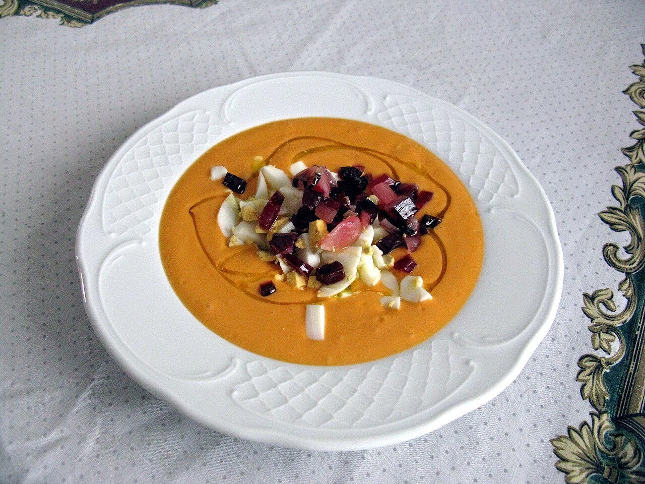 Salmorejo, topped with chopped egg and jamón — thicker than gazpacho, and a Córdoba dish rather than a general Andalusian one.